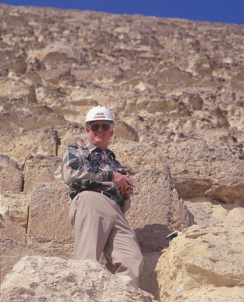 Photo of Dr. Craig B. Smith standing on the Great Pyramid