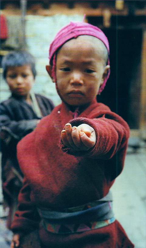 photo of Boy Offering His Marbles