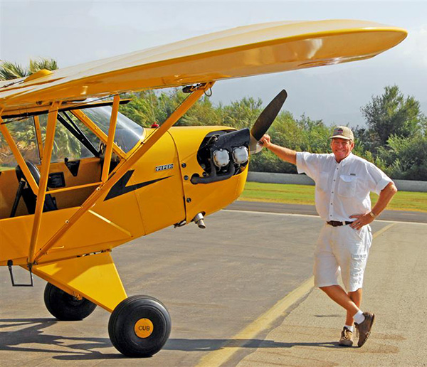 Photo of Bern Heimos and vintage 1939 Piper Cub
