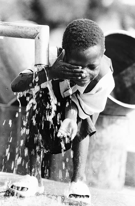 Photo of Child Washing from water provided by a Safe Water Project