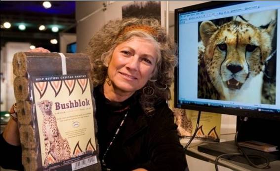 Photo of Dr. Laurie Marker with Thorn Bush Fuel Logs - Bushblok
