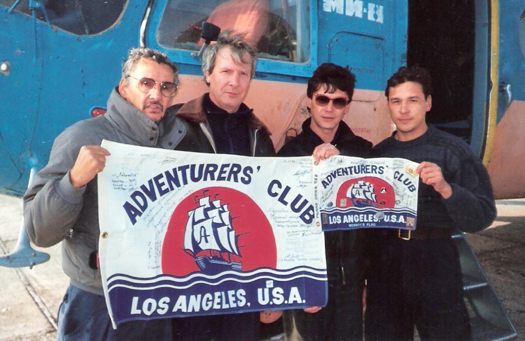 Photo of Pierre Odier with Adventurers Club Flag