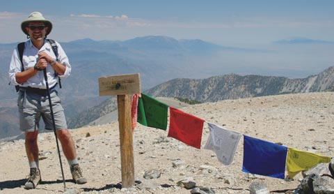 Photo of Ricardo Flores on Mt. Baldy with Prayer Flags