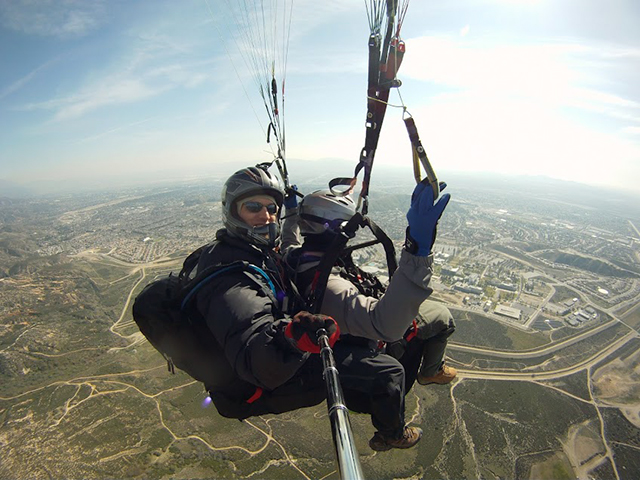 Photo of Aaron Price flying a tandem passenger out in San Bernardino