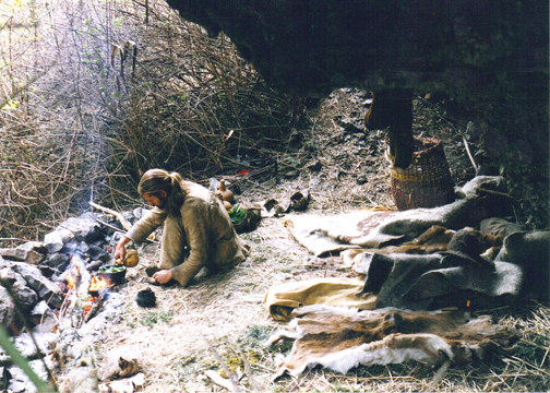 Photo of Chris Morasky at a Rock Shelter in Hell's Canyon Wilderness of Oregon. Cooking Stinging Nettles in a Clay Pot
