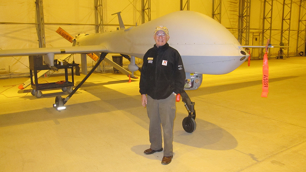 Photo of Nissen Davis in the Predator UAV hanger at Joint Base Balud, Iraq